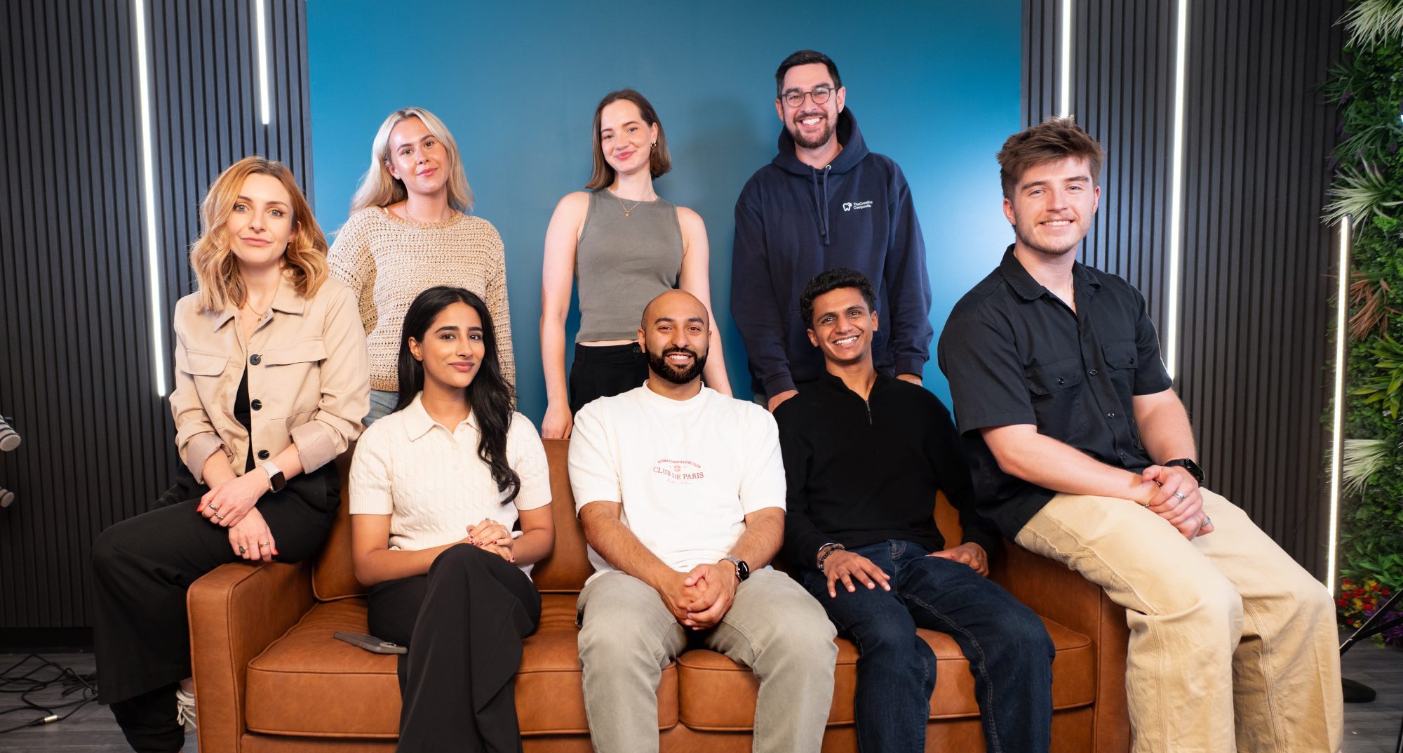 The Creative Composite Team digital marketing agency sitting on a sofa